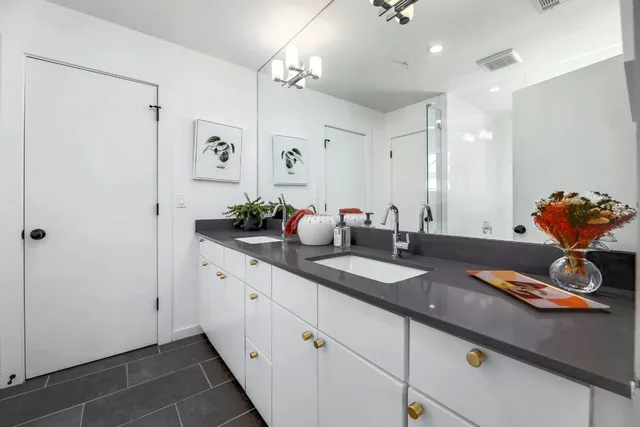 a bathroom with sink and mirror