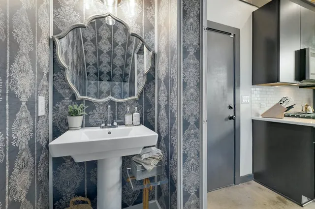 a bathroom with a sink and a mirror
