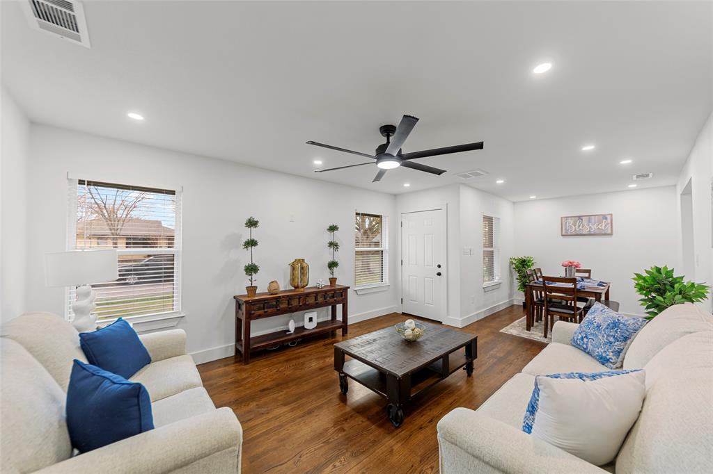 2945 Healey Drive Dallas, TX 75228 - Photo 3 of 38 a living room with furniture and a wooden floor