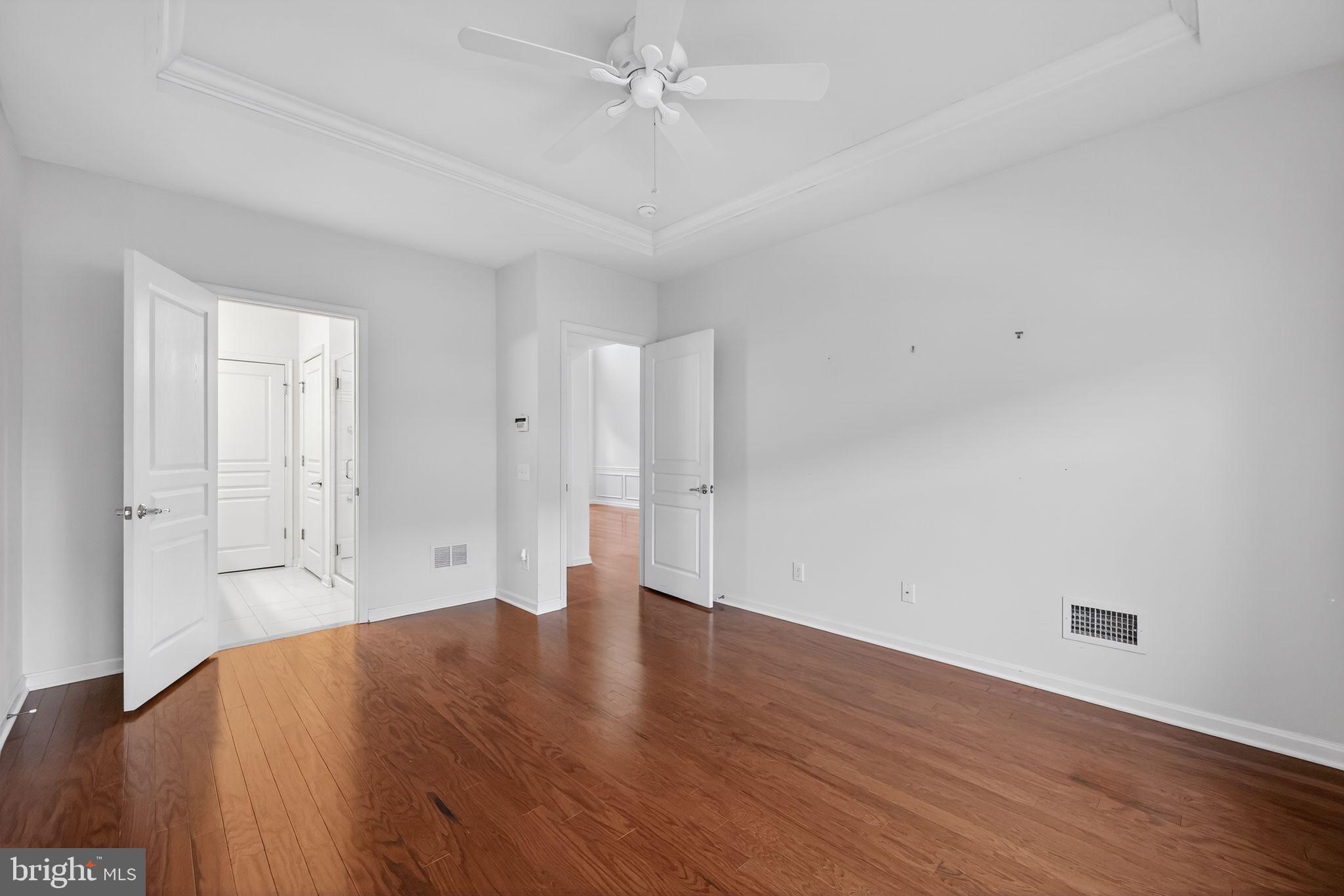 27 Stokes Avenue Voorhees, NJ 08043 - Photo 12 of 39 an empty room with wooden floor and windows