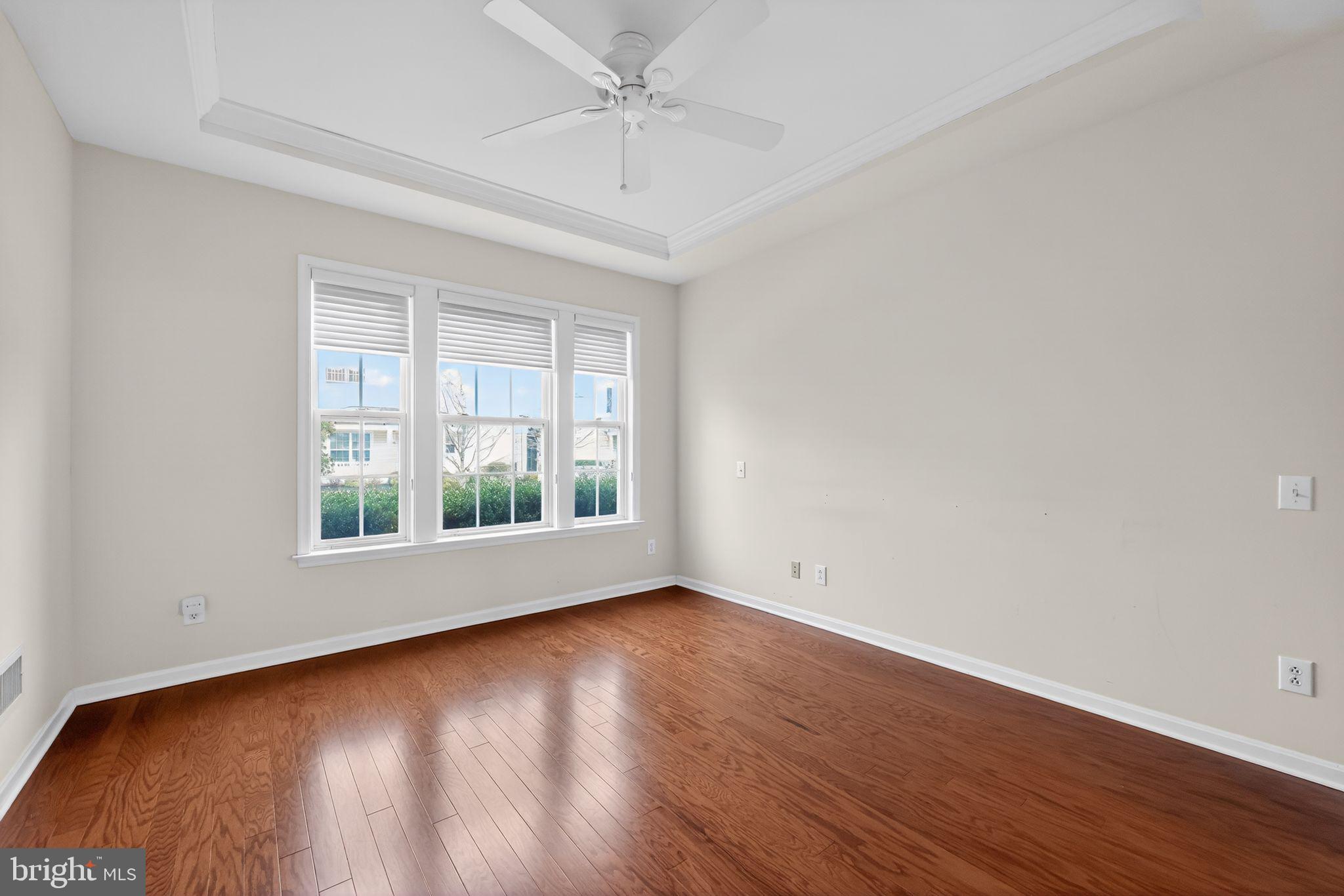 27 Stokes Avenue Voorhees, NJ 08043 - Photo 13 of 39 an empty room with wooden floor and windows