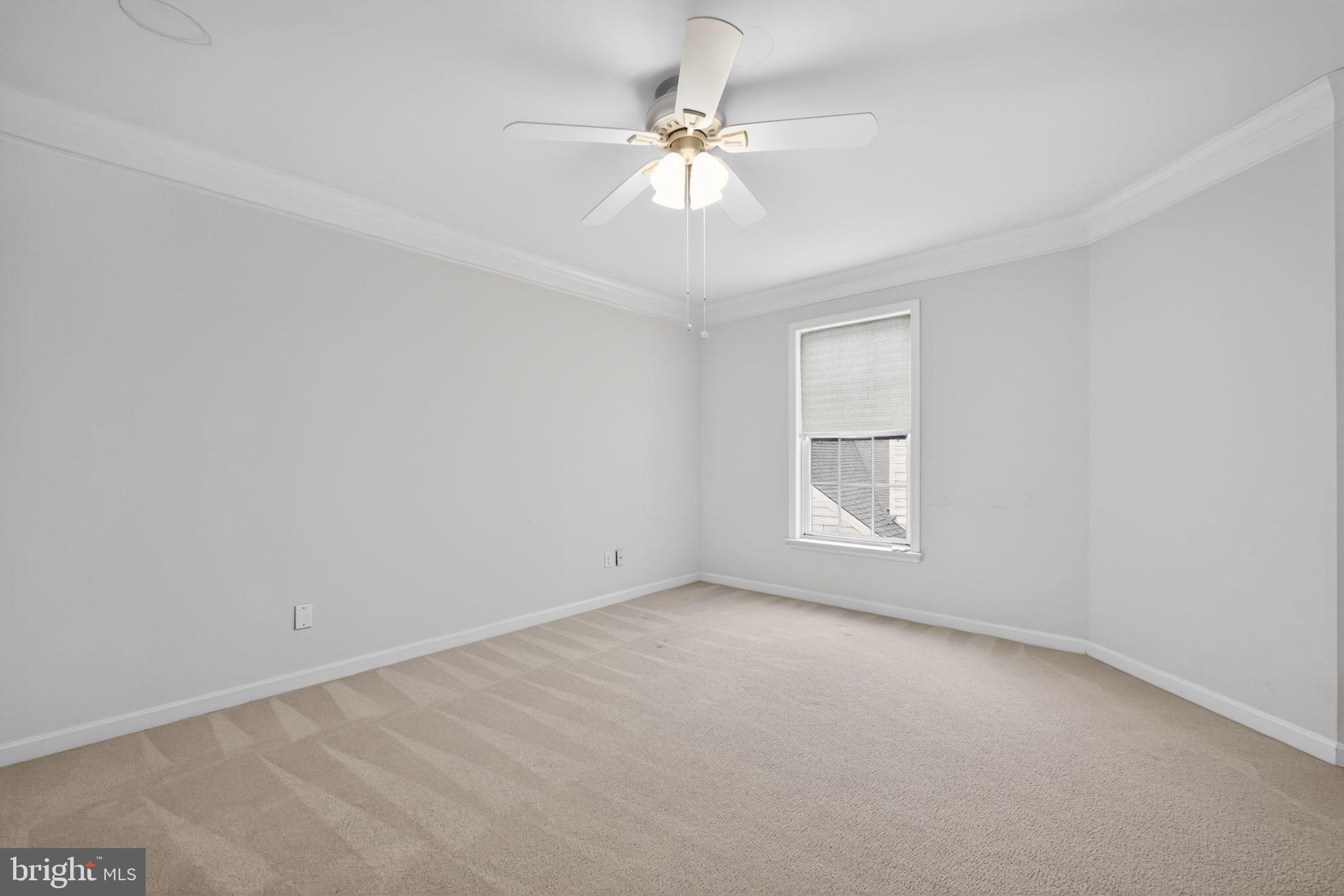 27 Stokes Avenue Voorhees, NJ 08043 - Photo 24 of 39 an empty room with a window and a fan