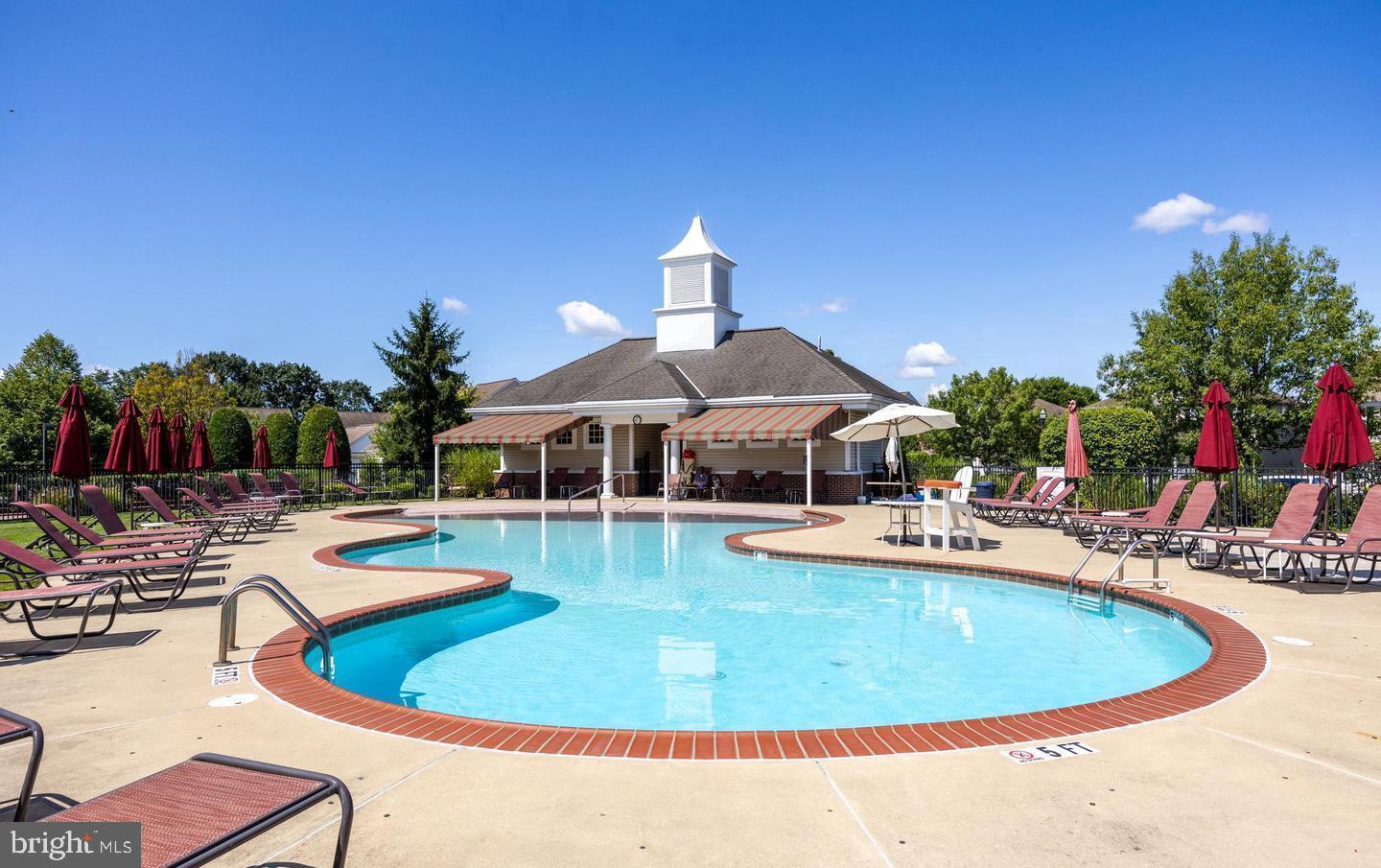 27 Stokes Avenue Voorhees, NJ 08043 - Photo 30 of 39 a view of a swimming pool with lounge chairs