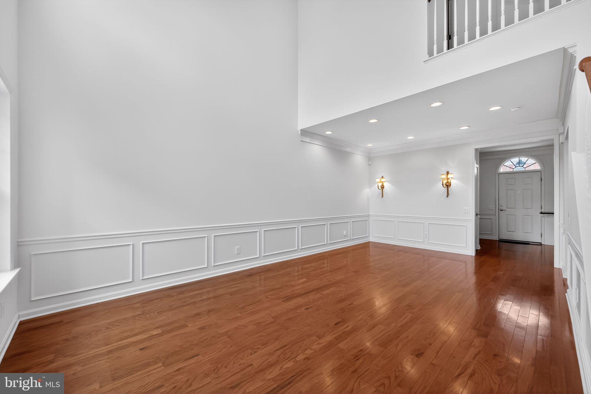 27 Stokes Avenue Voorhees, NJ 08043 - Photo 6 of 39 a view of an empty room with wooden floor