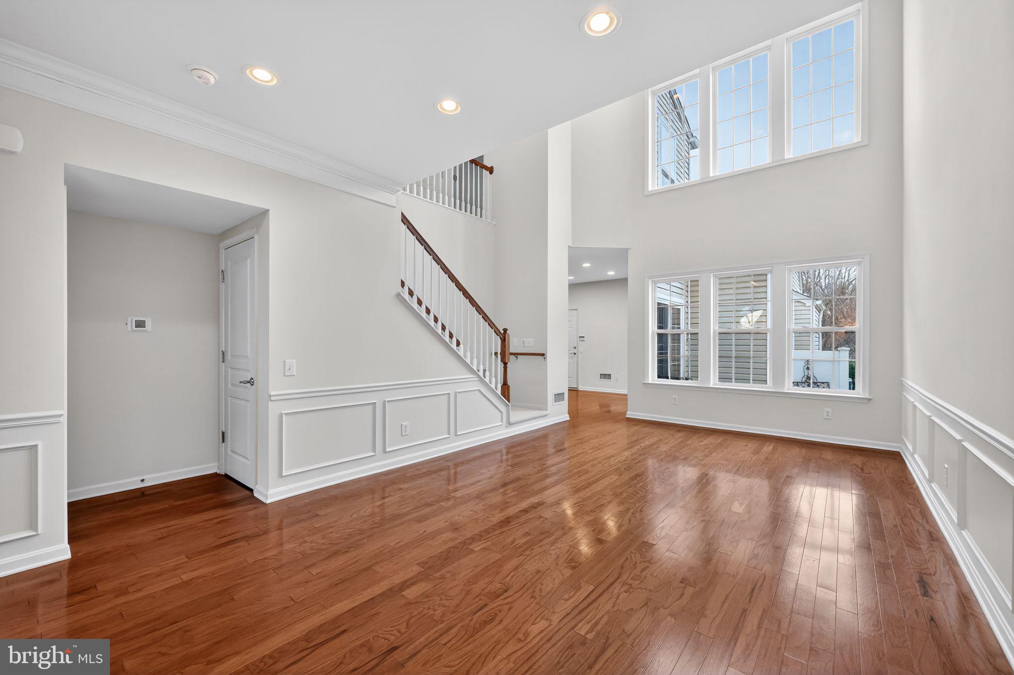 27 Stokes Avenue Voorhees, NJ 08043 - Photo 7 of 39 a view of an empty room with wooden floor and a window