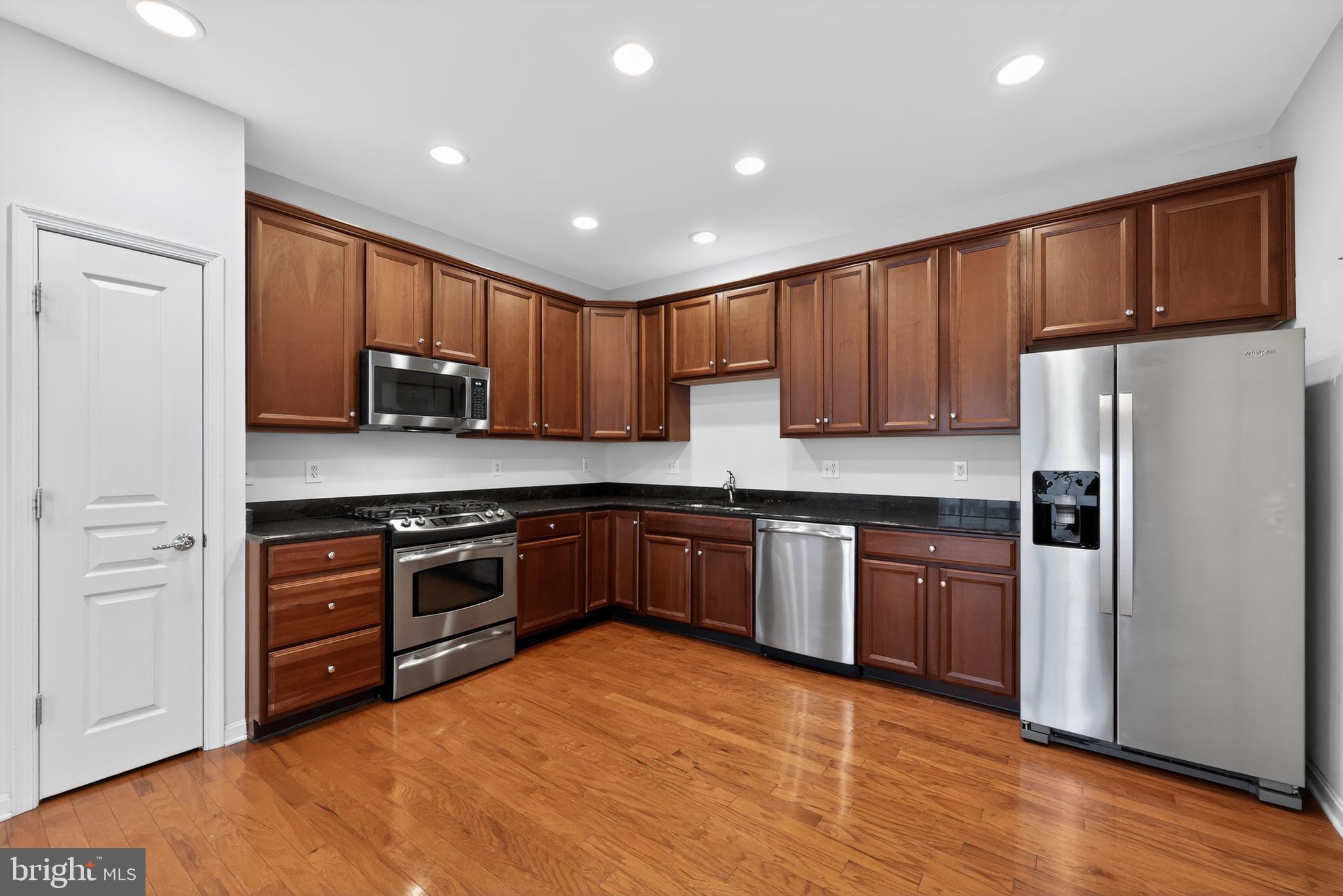 27 Stokes Avenue Voorhees, NJ 08043 - Photo 9 of 39 a kitchen with stainless steel appliances granite countertop a refrigerator stove top oven and sink