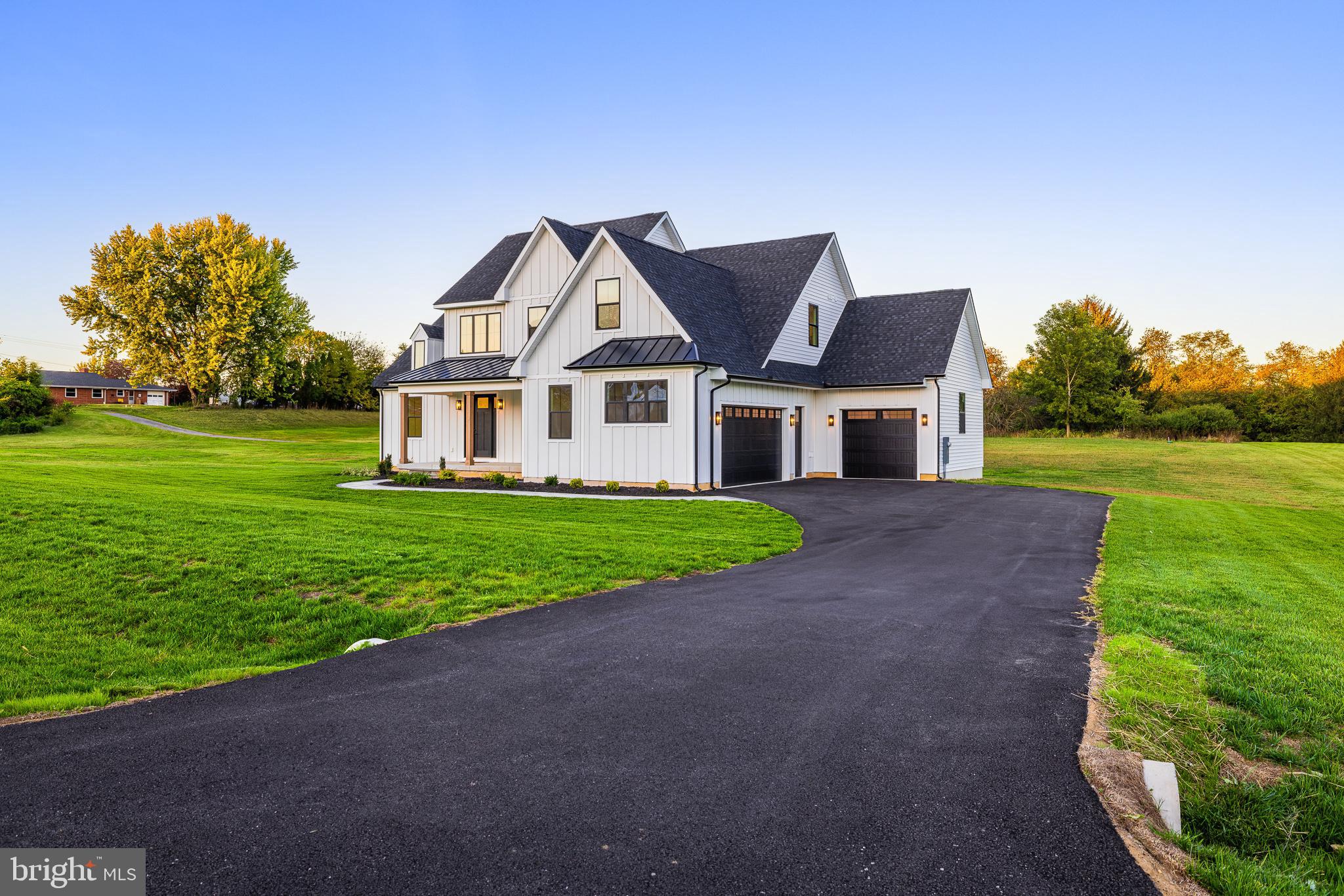 415 Marcus Road Townsend, DE 19734 - Photo 11 of 115 a front view of a house with a yard and trees