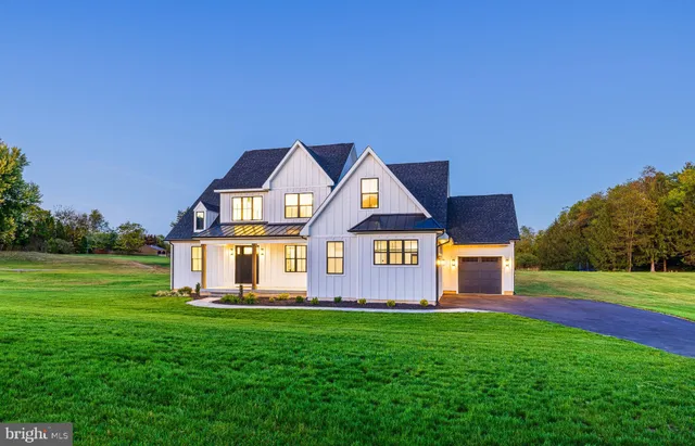 a kitchen with stainless steel appliances granite countertop a refrigerator a stove and a sink with cabinets