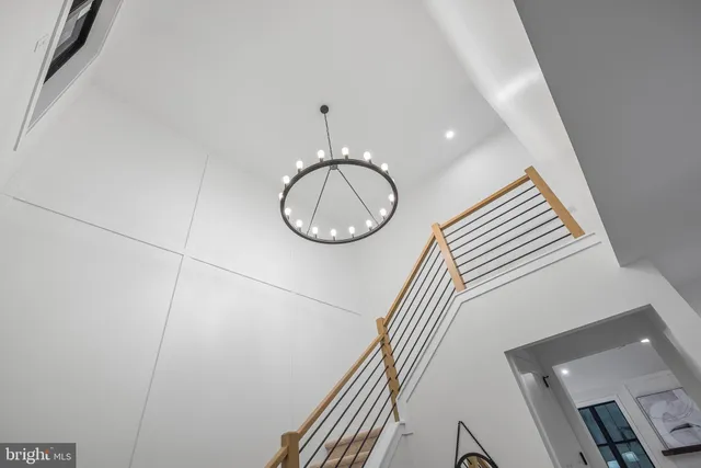 a living room with furniture and a lamp