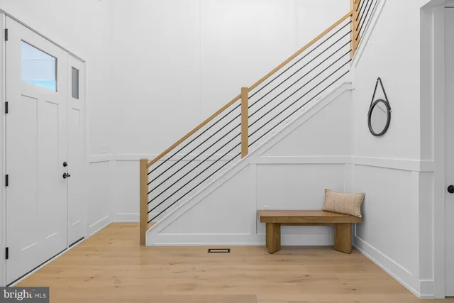 a living room with furniture a large window and a fireplace
