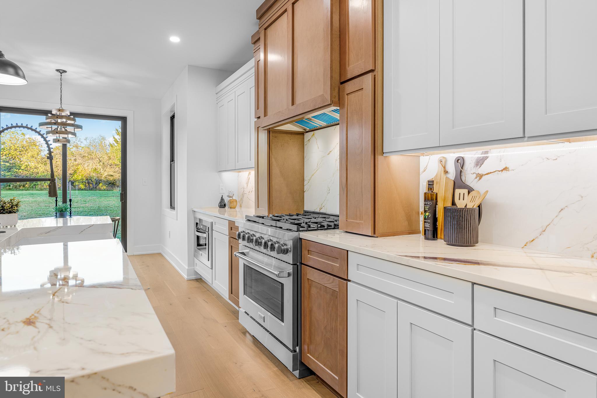 415 Marcus Road Townsend, DE 19734 - Photo 32 of 115 a kitchen with stainless steel appliances granite countertop a stove a sink and a refrigerator