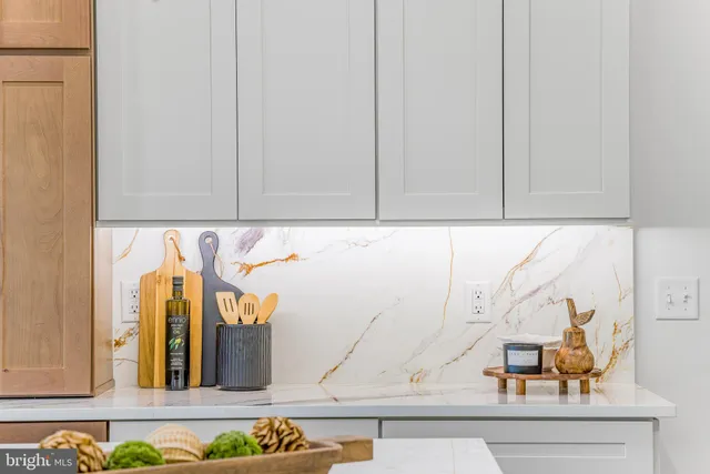 a bathroom with a double vanity sink toilet mirror and shower