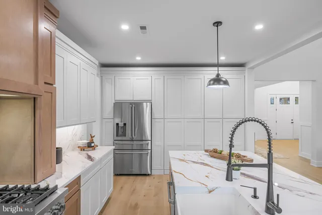 a bathroom with a shower and a sink