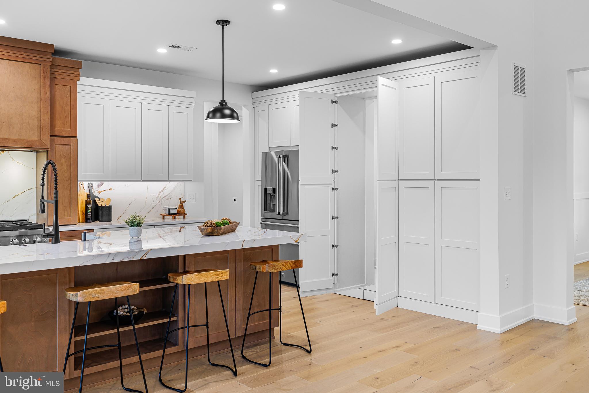 415 Marcus Road Townsend, DE 19734 - Photo 40 of 115 a kitchen with stainless steel appliances granite countertop white cabinets a refrigerator and a sink