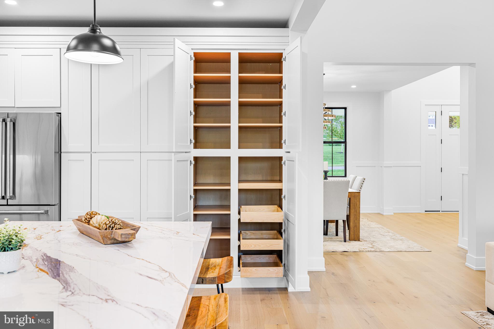 415 Marcus Road Townsend, DE 19734 - Photo 43 of 115 a bedroom with a bed and a chandelier