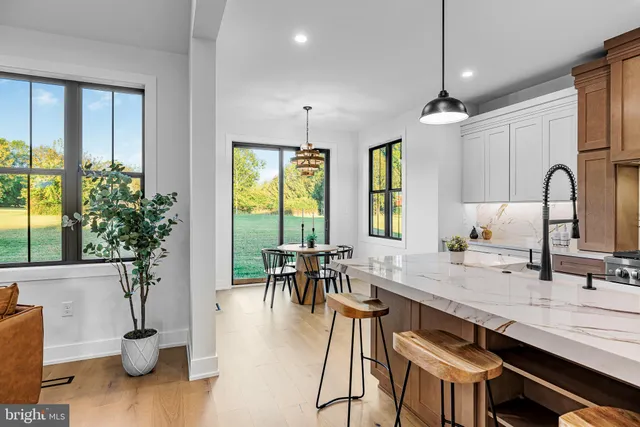 a front view of a house with a garden and porch