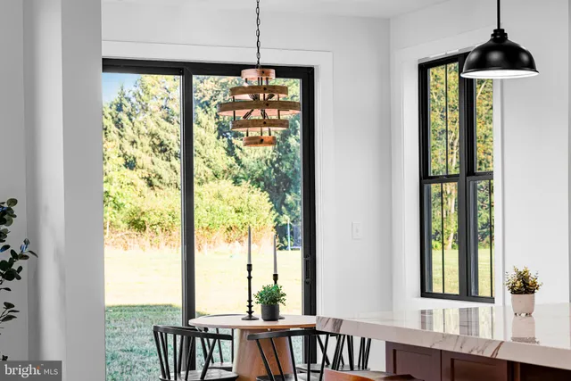 a work room with furniture and a flat screen tv