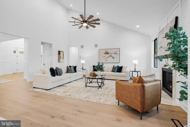 a front view of a house with a garden and yard