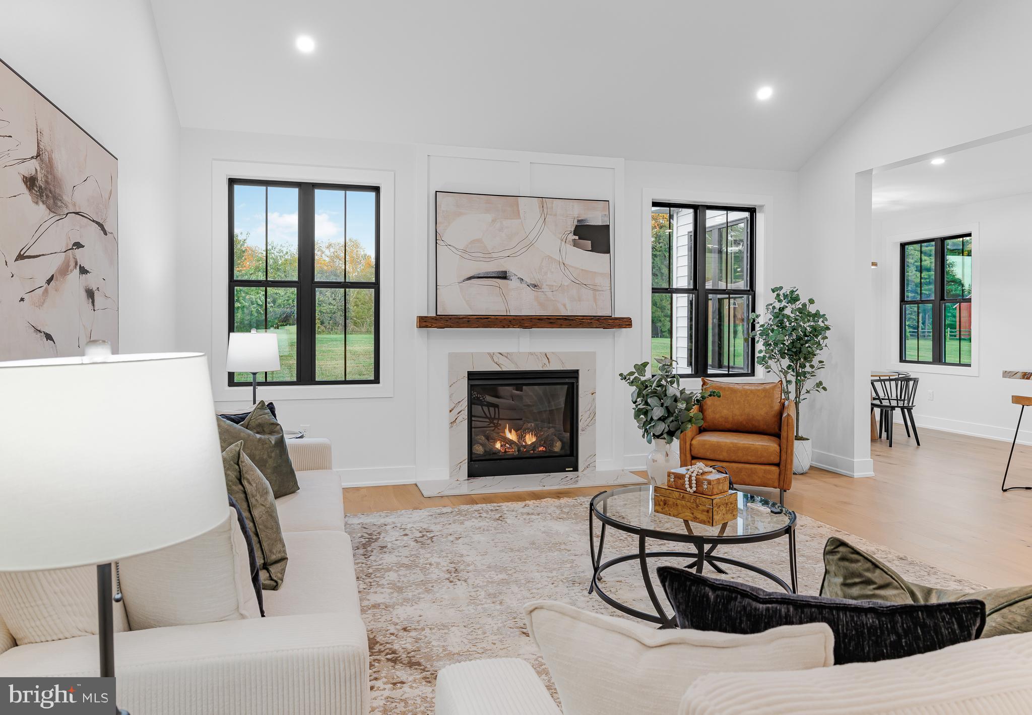 415 Marcus Road Townsend, DE 19734 - Photo 53 of 115 a living room with furniture a large window and a fireplace