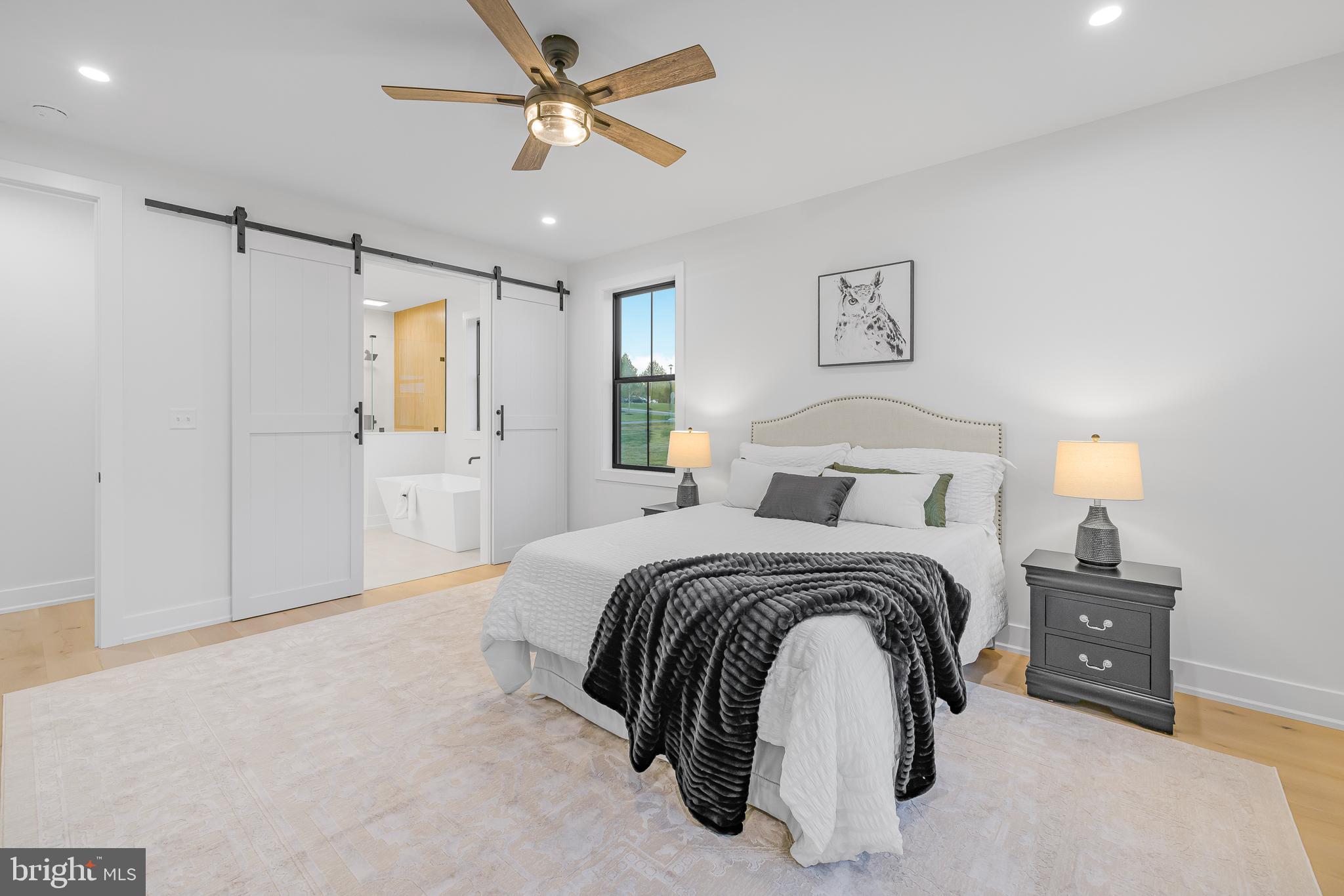 415 Marcus Road Townsend, DE 19734 - Photo 61 of 115 a spacious bedroom with a bed and a chandelier