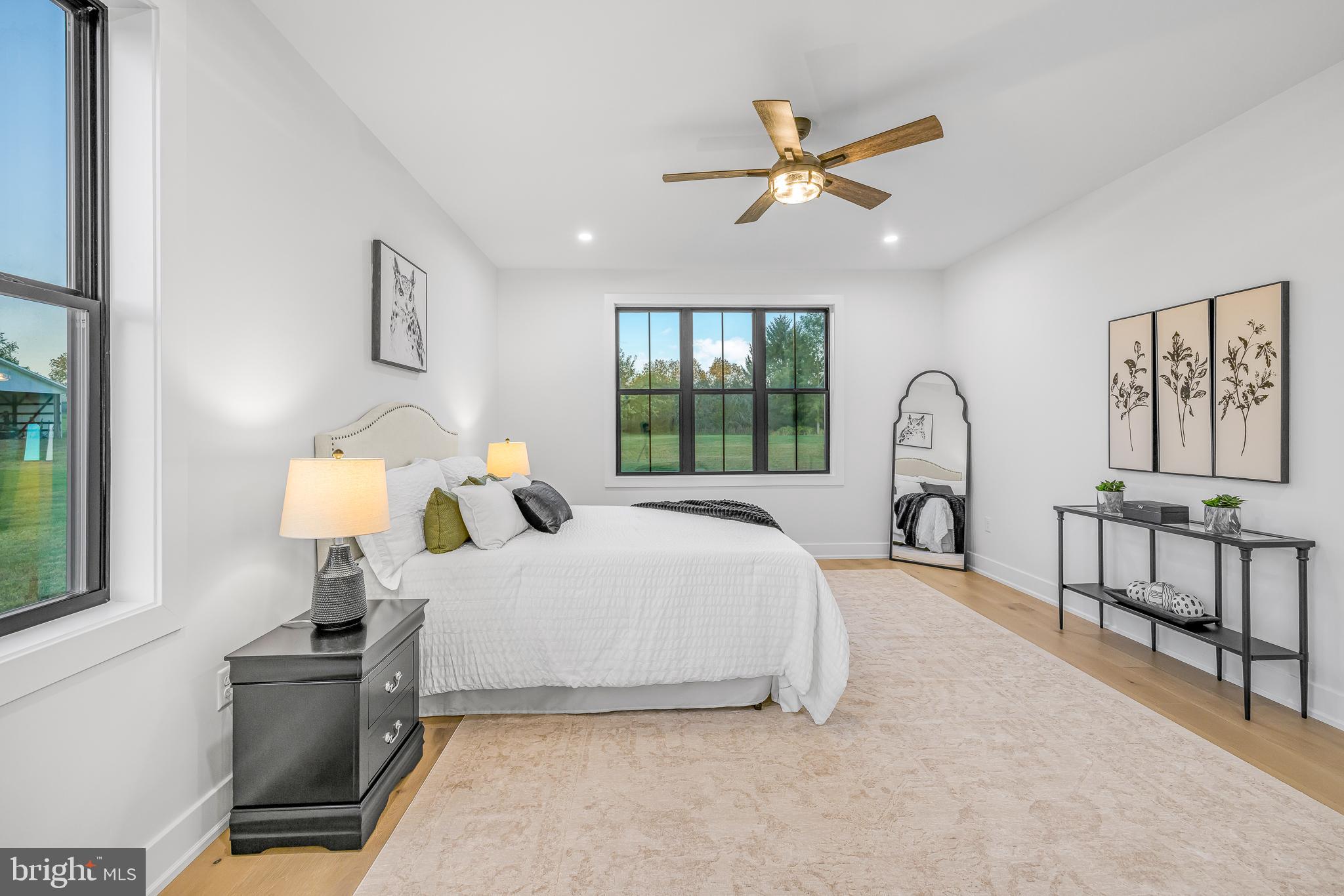 415 Marcus Road Townsend, DE 19734 - Photo 64 of 115 a bedroom with a large bed and a chandelier