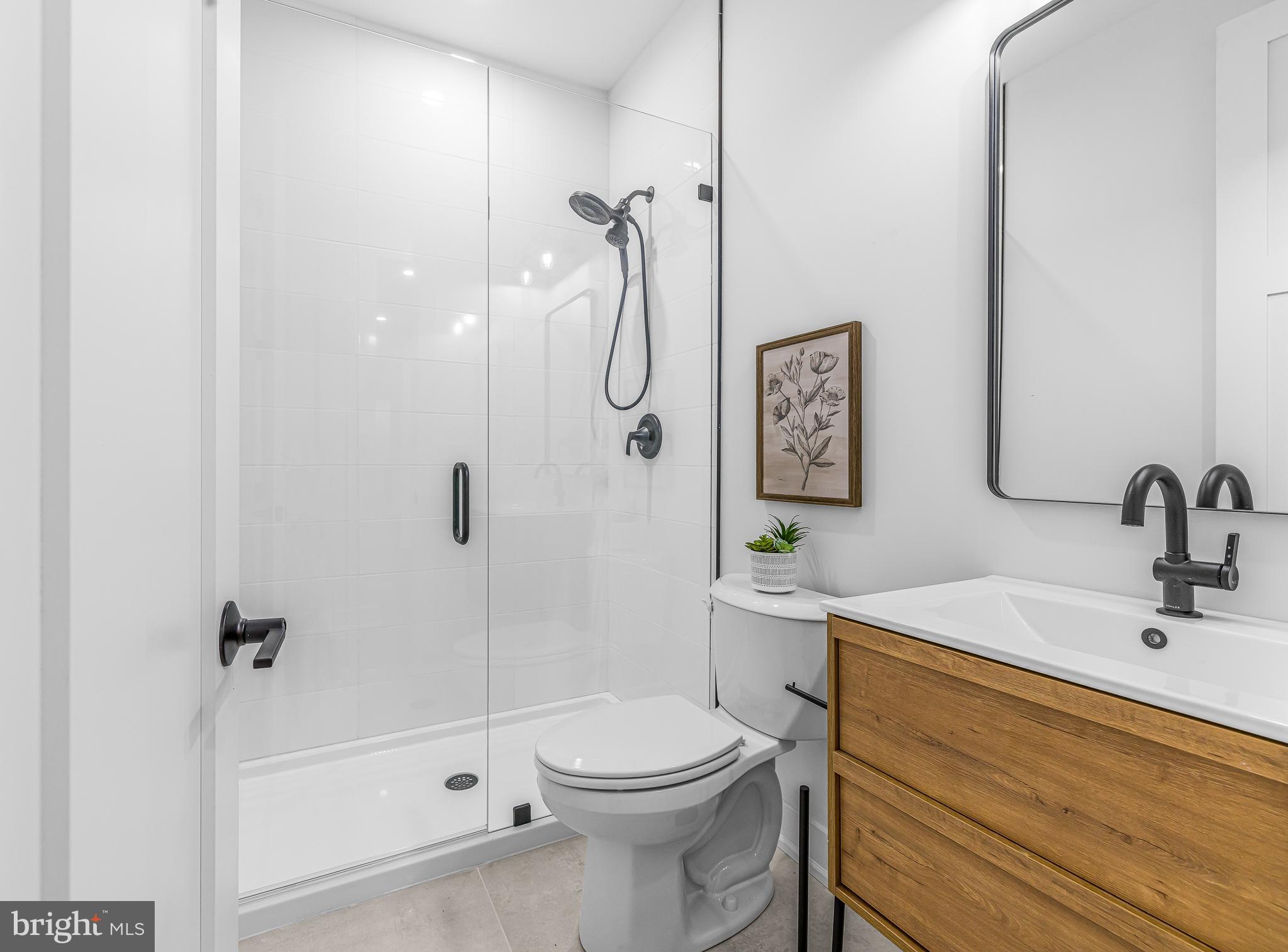 415 Marcus Road Townsend, DE 19734 - Photo 77 of 115 a bathroom with a sink a toilet and shower