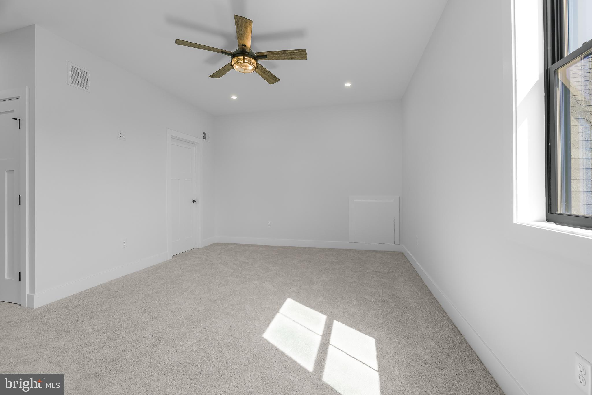 415 Marcus Road Townsend, DE 19734 - Photo 91 of 115 an empty room with a window and a fan