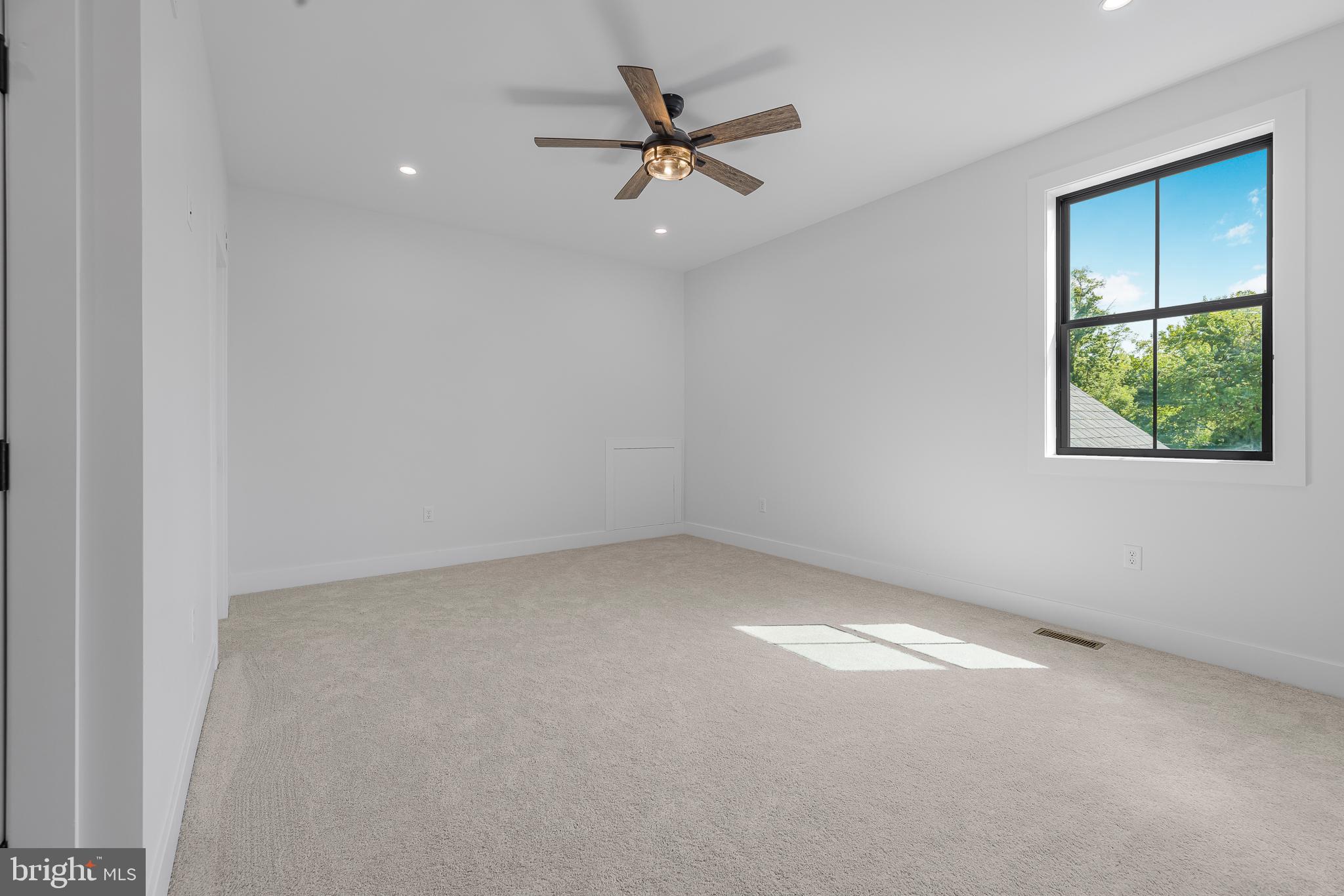 415 Marcus Road Townsend, DE 19734 - Photo 92 of 115 an empty room with a ceiling fan and window