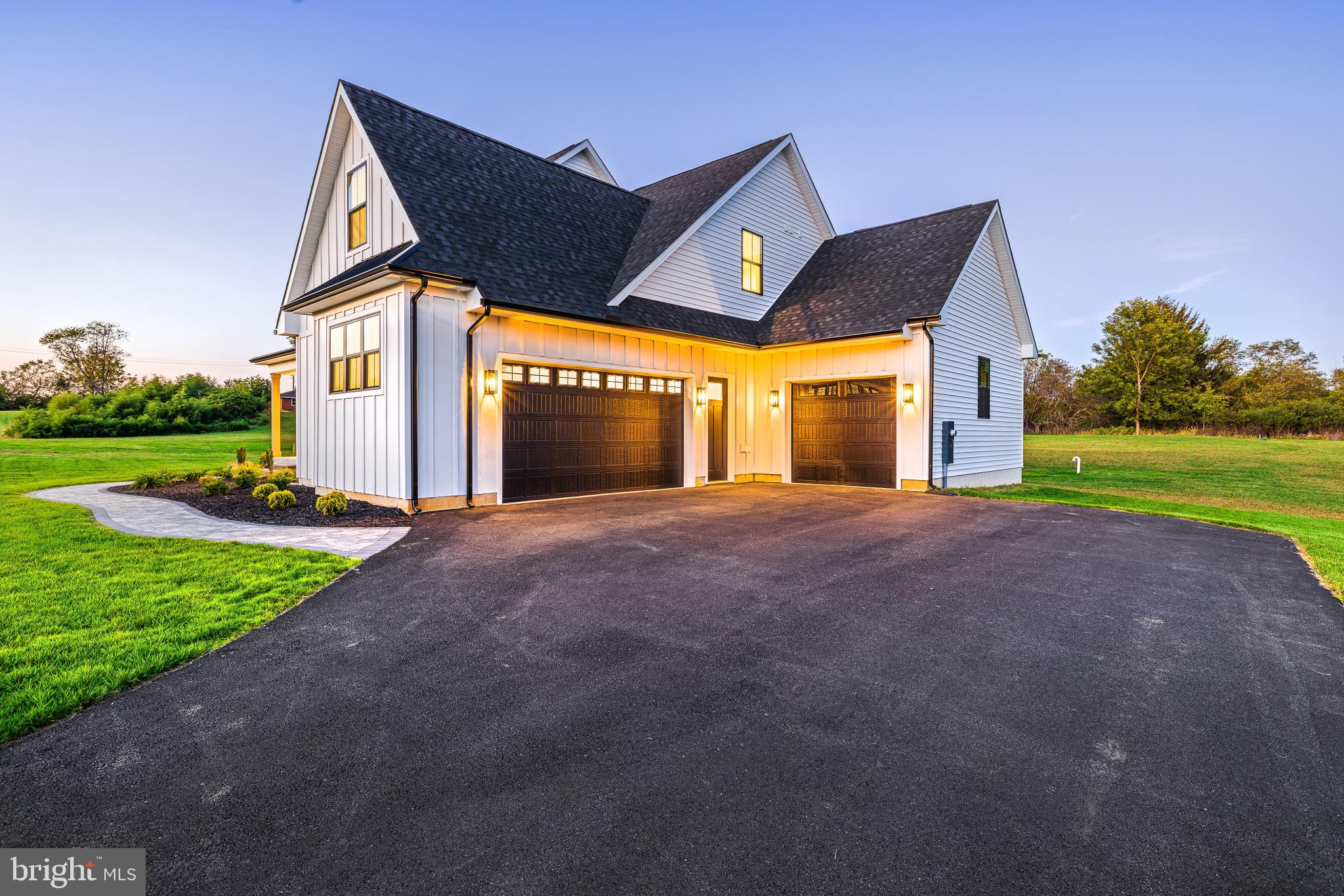 415 Marcus Road Townsend, DE 19734 - Photo 10 of 115 a front view of a house with a yard and garage