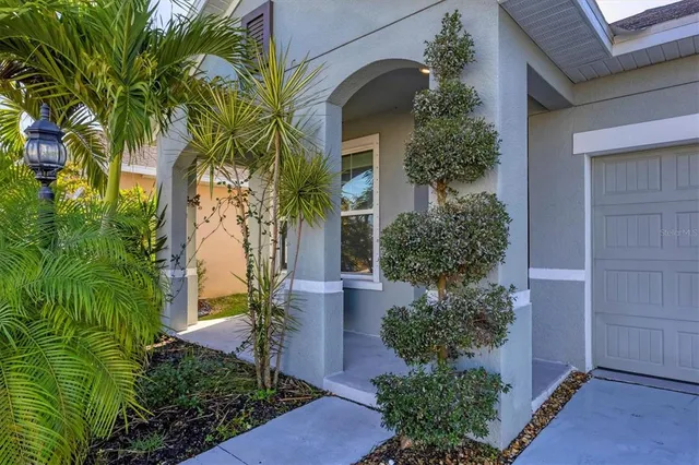 front view of a house with a garden