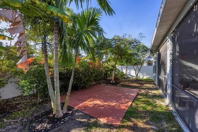 a backyard of a house with yard and outdoor seating