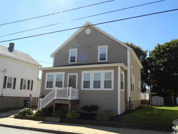 659 Cambridge Street Fall River, MA 02721 - Photo 1 of 18 a front view of a house with a yard
