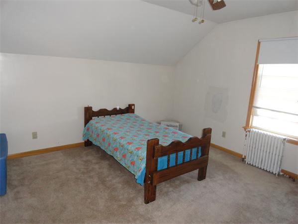 659 Cambridge Street Fall River, MA 02721 - Photo 17 of 18 a room with a bed and a window