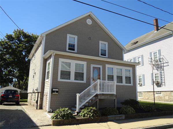 659 Cambridge Street Fall River, MA 02721 - Photo 2 of 18 a view of multiple house with a yard