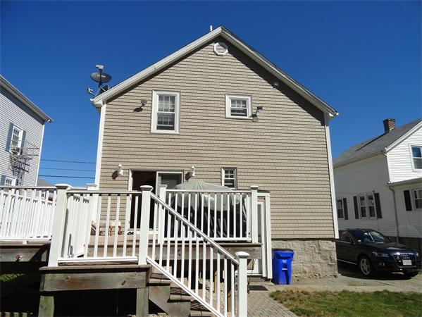659 Cambridge Street Fall River, MA 02721 - Photo 3 of 18 a view of a house with a small yard and wooden fence