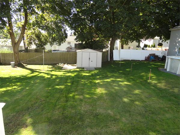 659 Cambridge Street Fall River, MA 02721 - Photo 5 of 18 a swimming pool with large trees