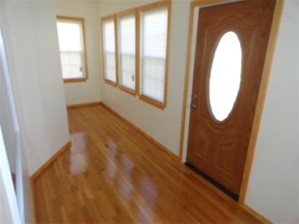 659 Cambridge Street Fall River, MA 02721 - Photo 10 of 18 a view of a room with wooden floor and windows