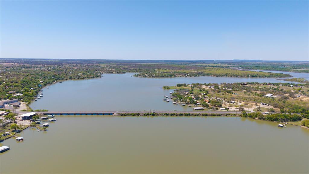 Lot 23 Turner Ranch Road Brownwood, TX 76801 - Photo 7 of 13 Expansive lake with a connecting bridge and surrounding residential areas