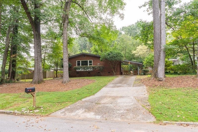1161 Greenbriar Circle Decatur, GA 30033 - Photo 1 of 1 a front view of a house with garden