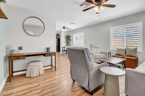 a living room with furniture and a window