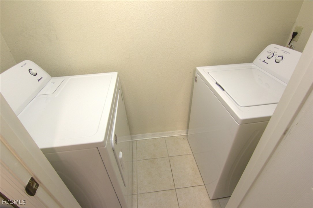 11490 Villa Grand, Unit 224 Fort Myers, FL 33913 - Photo 17 of 30 a utility room with dryer and washer