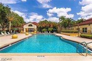 11490 Villa Grand, Unit 224 Fort Myers, FL 33913 - Photo 29 of 30 a view of swimming pool with a yard