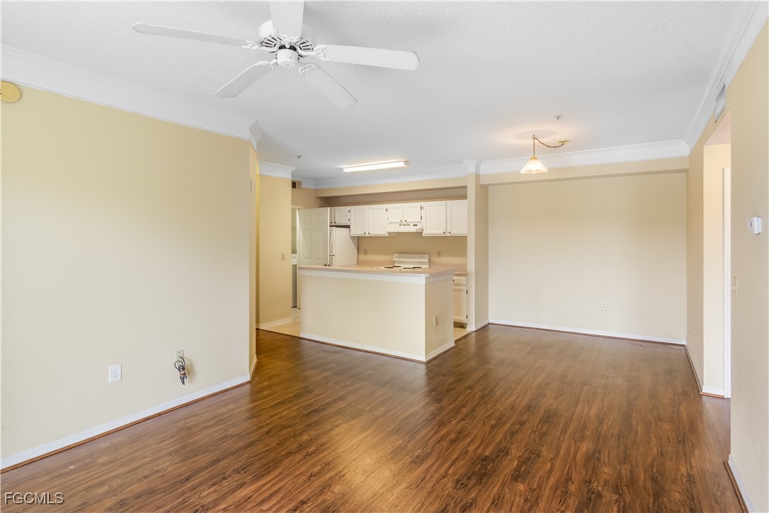 11490 Villa Grand, Unit 224 Fort Myers, FL 33913 - Photo 8 of 30 a view of a kitchen with wooden floor and a kitchen