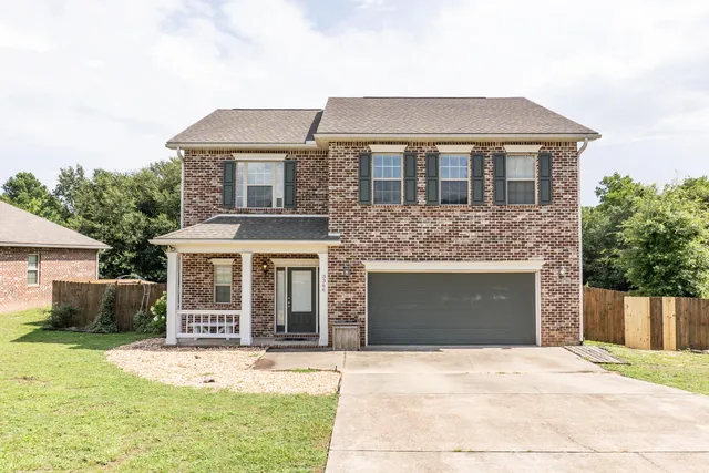 a front view of a house with yard