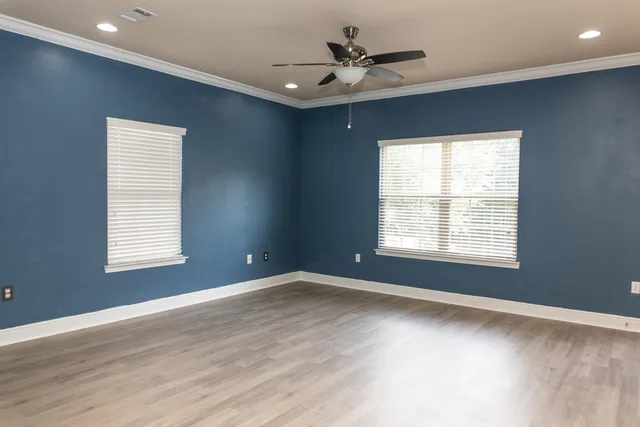 a view of an empty room with a window