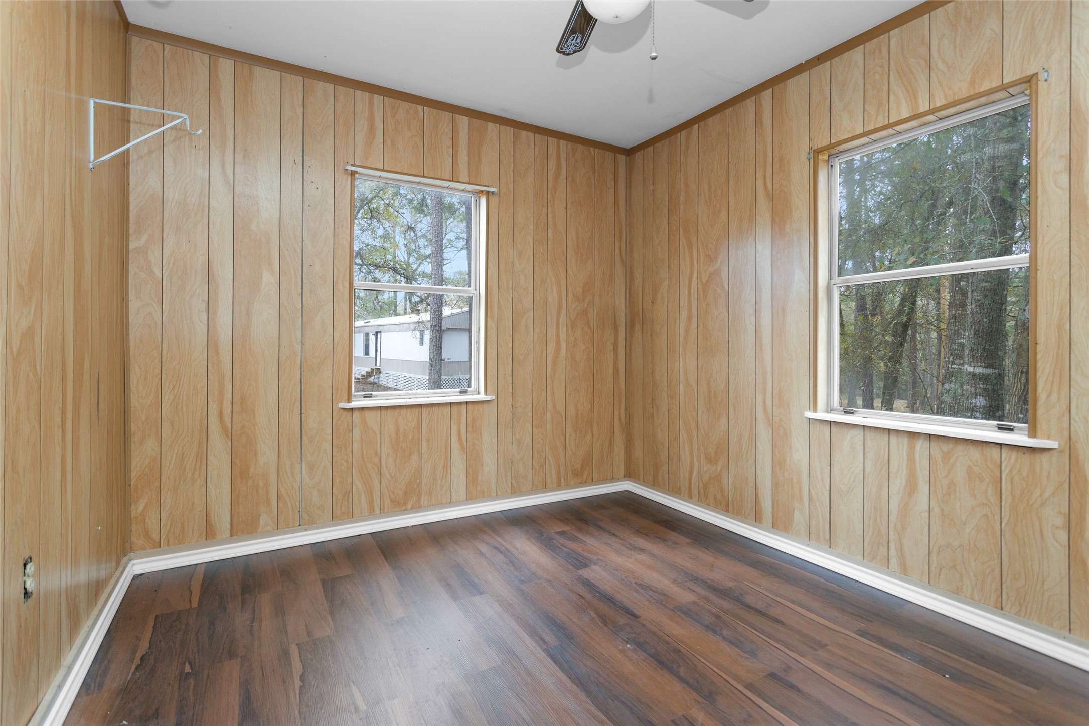 Split B Tall Pine Road Navasota, TX 77868 - Photo 14 of 21 an empty room with wooden floor and windows