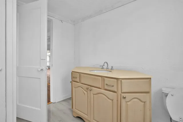 a utility room with cabinets washer and dryer