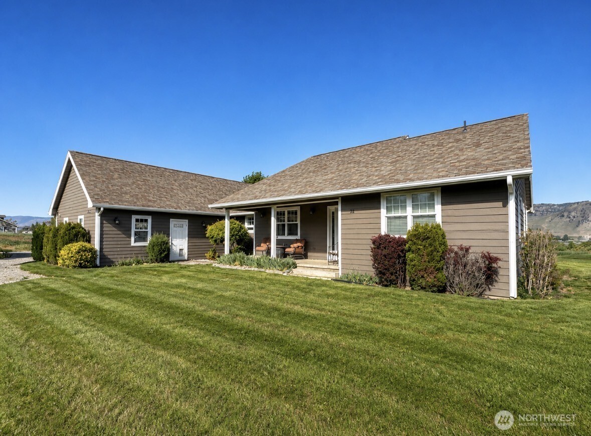 22 Rooster Flats Road Oroville, WA 98844 - Photo 1 of 28 a front view of a house with a yard