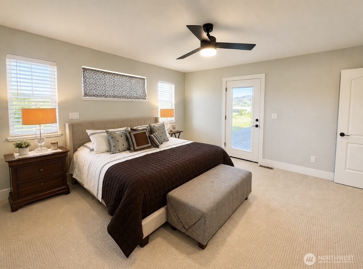22 Rooster Flats Road Oroville, WA 98844 - Photo 17 of 28 a bedroom with a bed and wooden floor