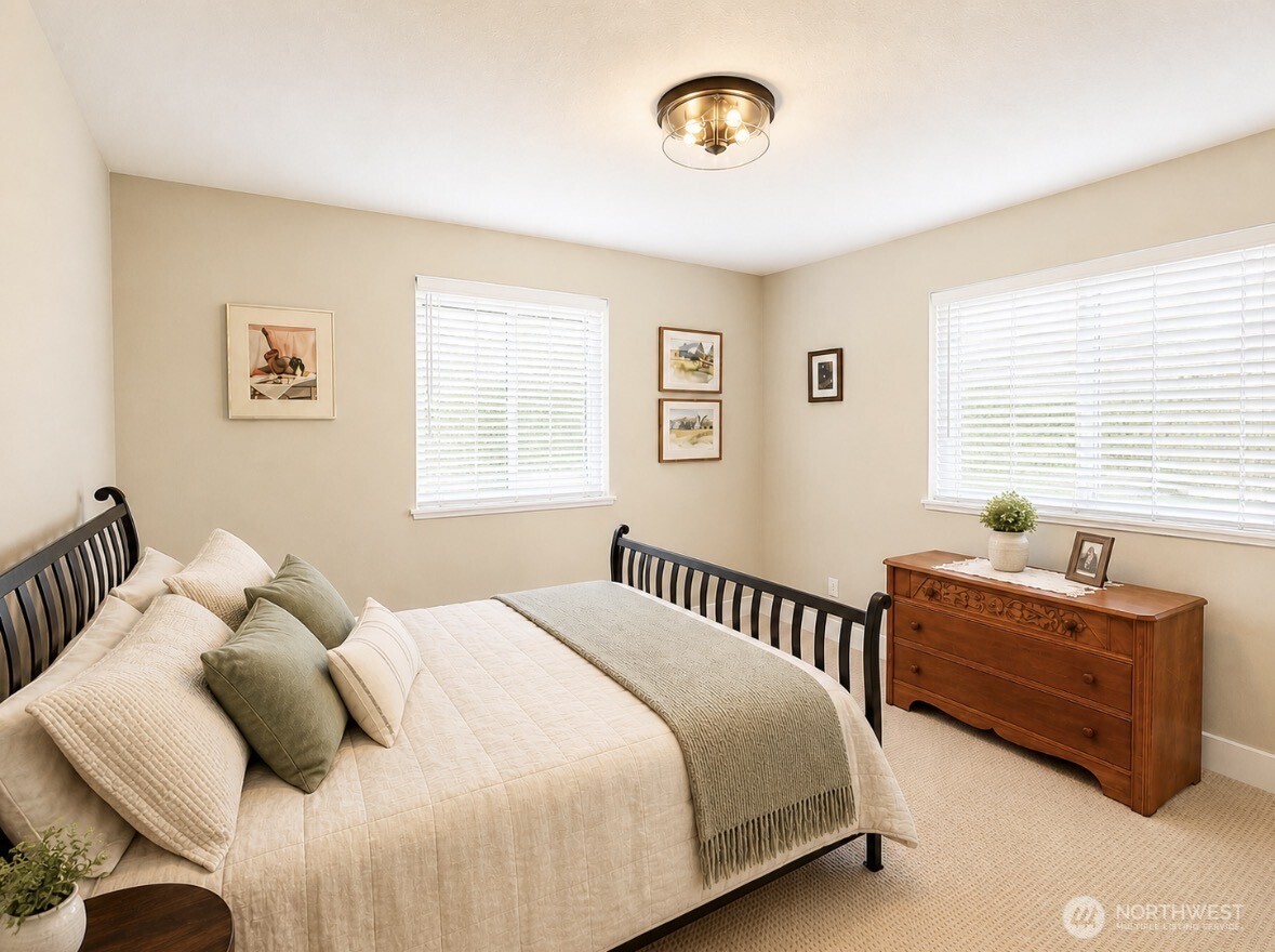 22 Rooster Flats Road Oroville, WA 98844 - Photo 20 of 28 a bedroom with bed and a window